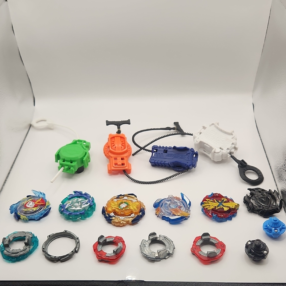 Lot Of Beyblades And Launchers.